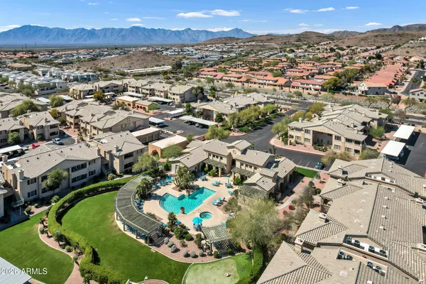 an aerial view of residential houses with outdoor space