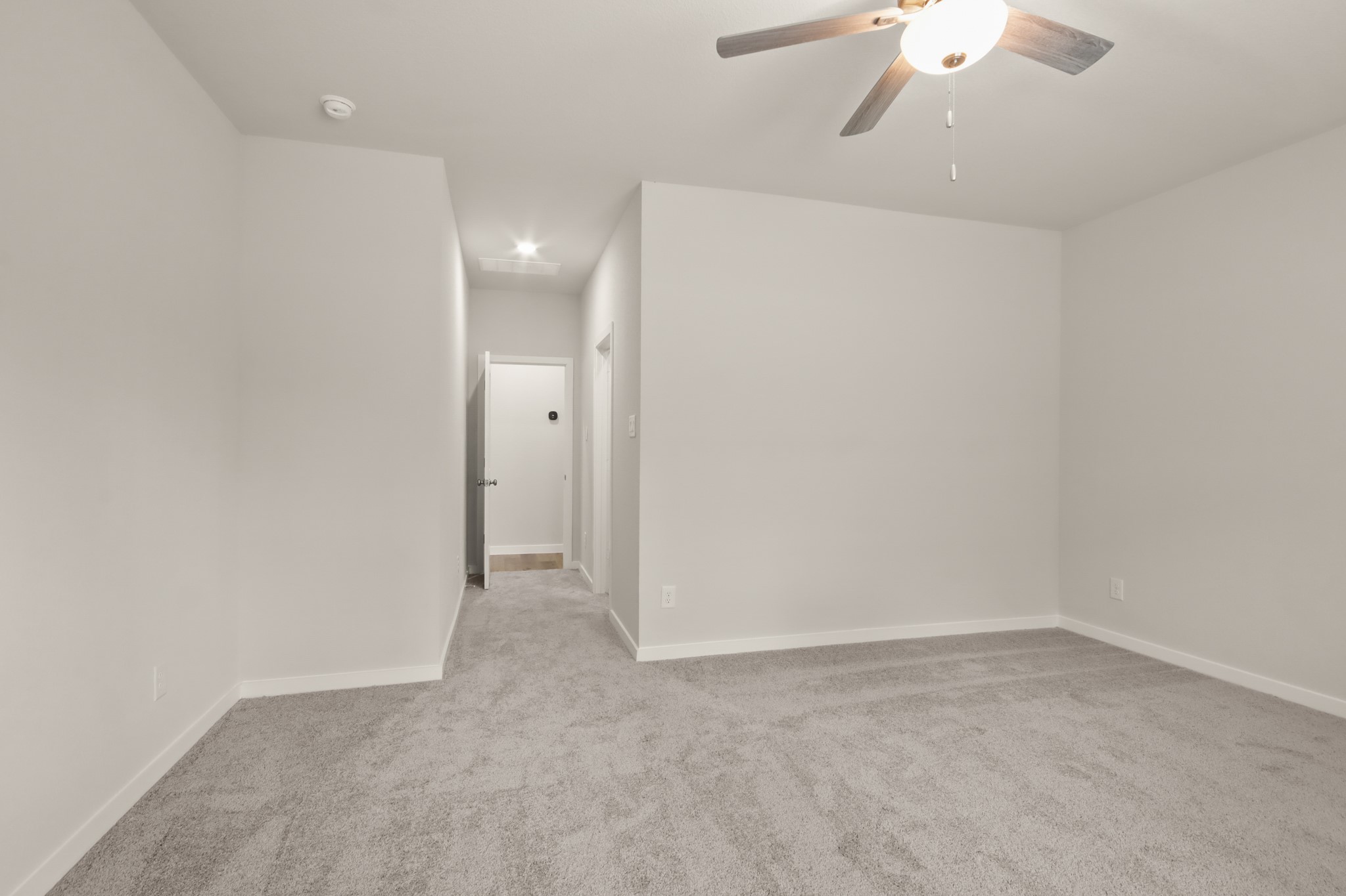16922 Needlepoint Drive Conroe, TX 77302 - Photo 13 of 31 an empty room with a empty space and a chandelier fan