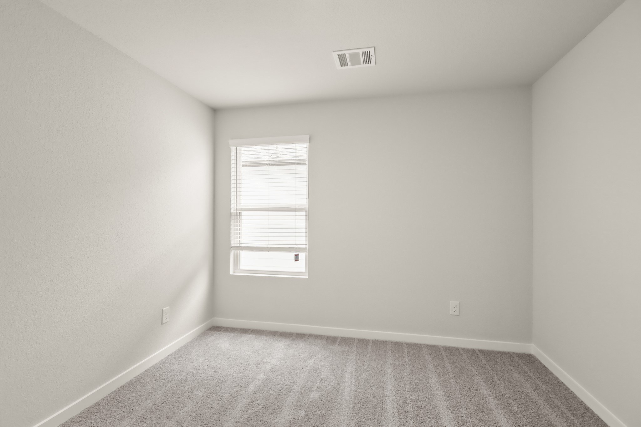 16922 Needlepoint Drive Conroe, TX 77302 - Photo 16 of 31 an empty room with a window