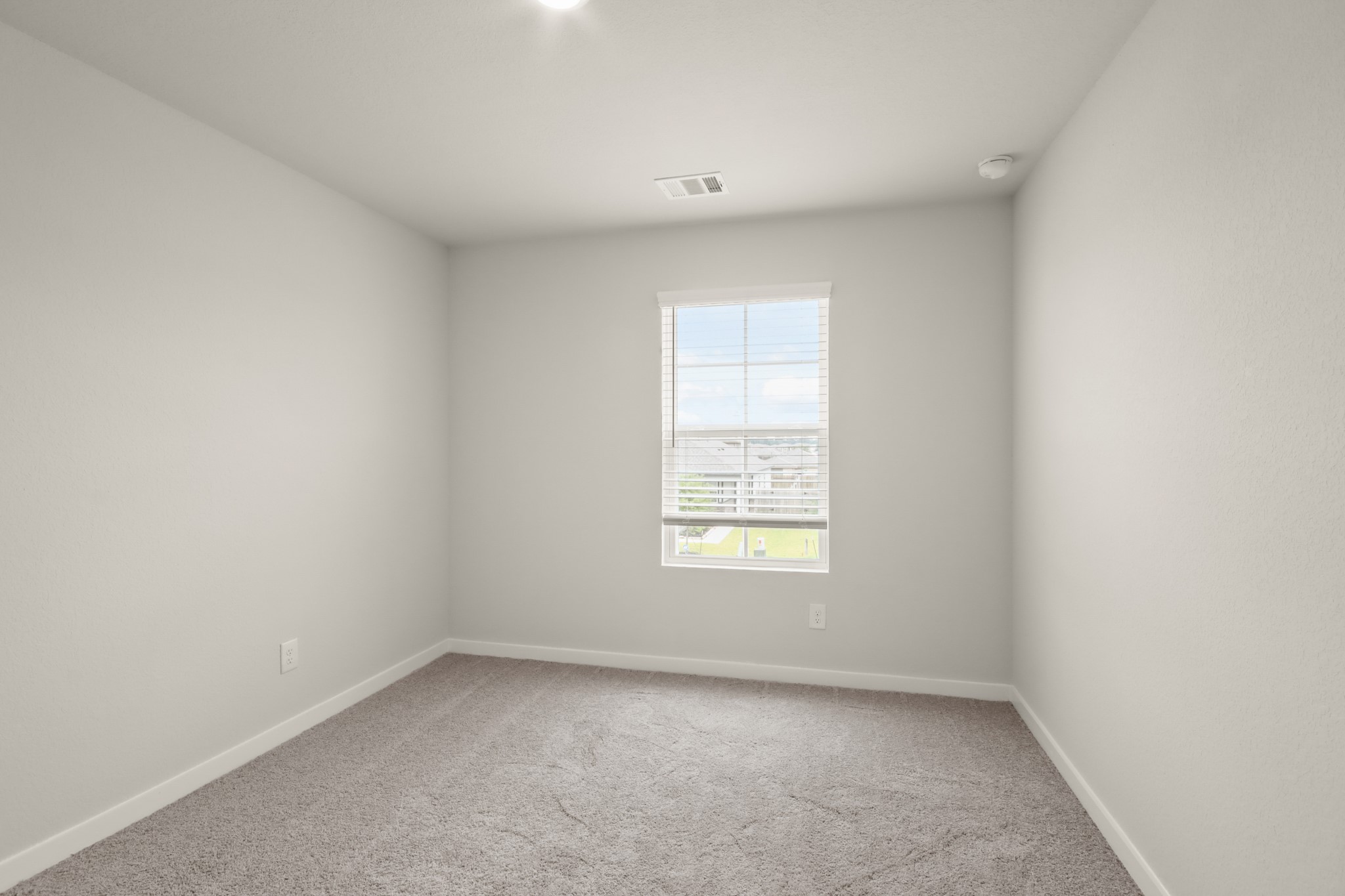 16922 Needlepoint Drive Conroe, TX 77302 - Photo 21 of 31 an empty room with a window