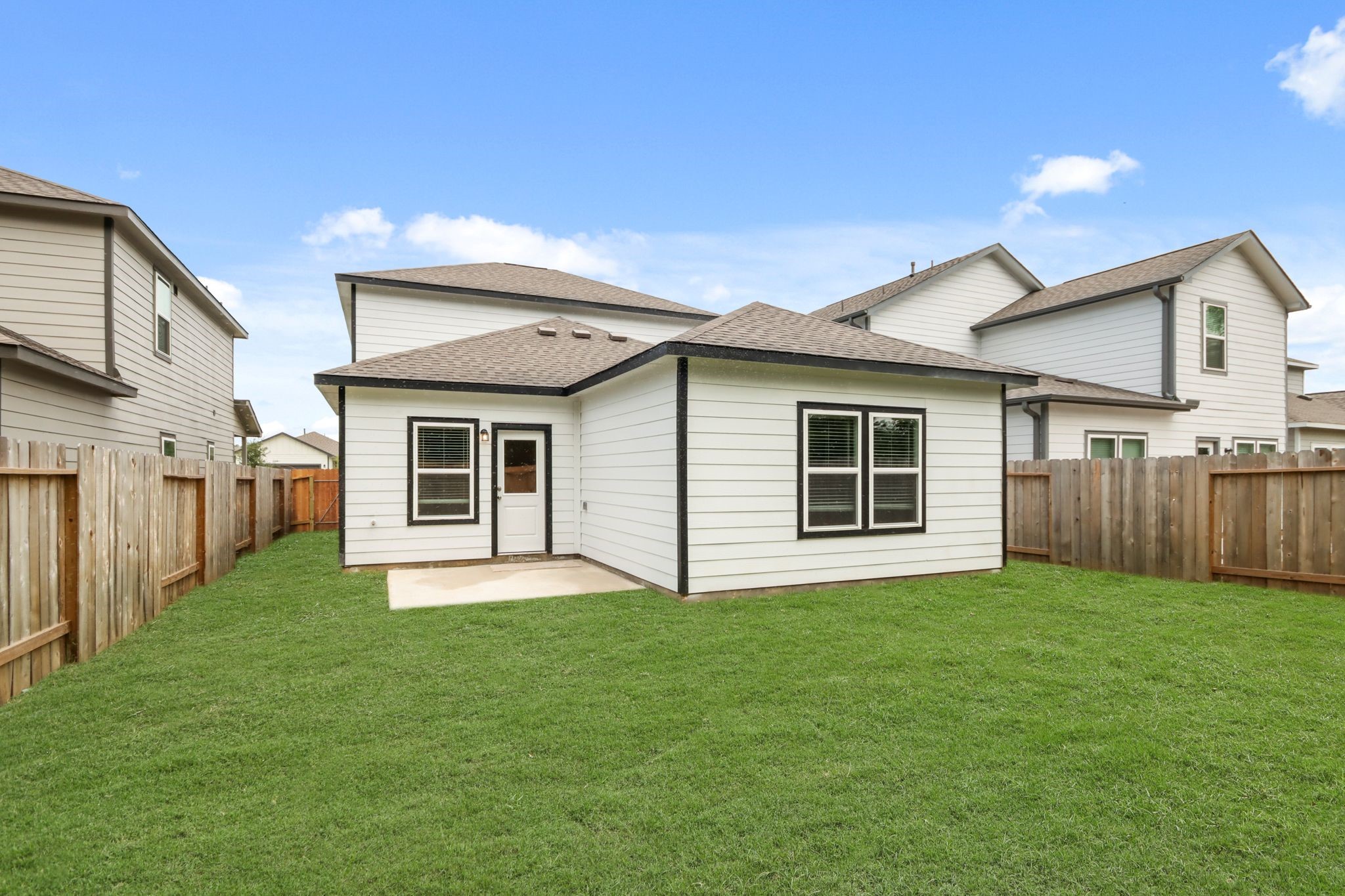 16922 Needlepoint Drive Conroe, TX 77302 - Photo 5 of 31 a front view of a house with a yard