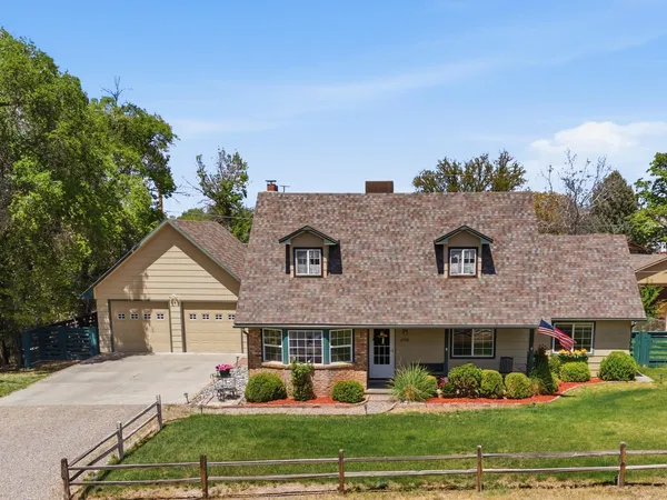 a view of house with yard