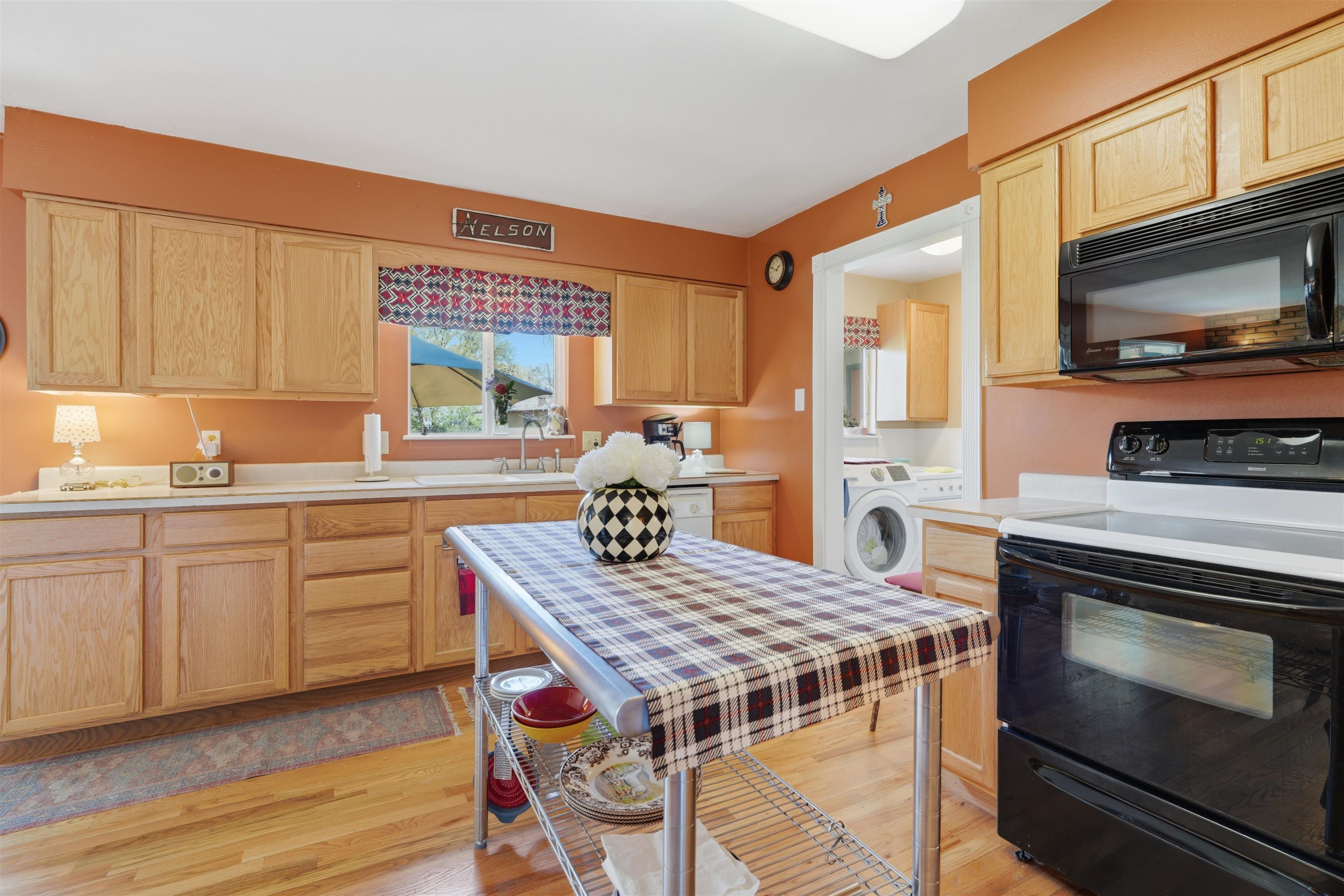 2350 E Road Grand Junction, CO 81507 - Photo 14 of 41 a kitchen with a stove a sink and a microwave