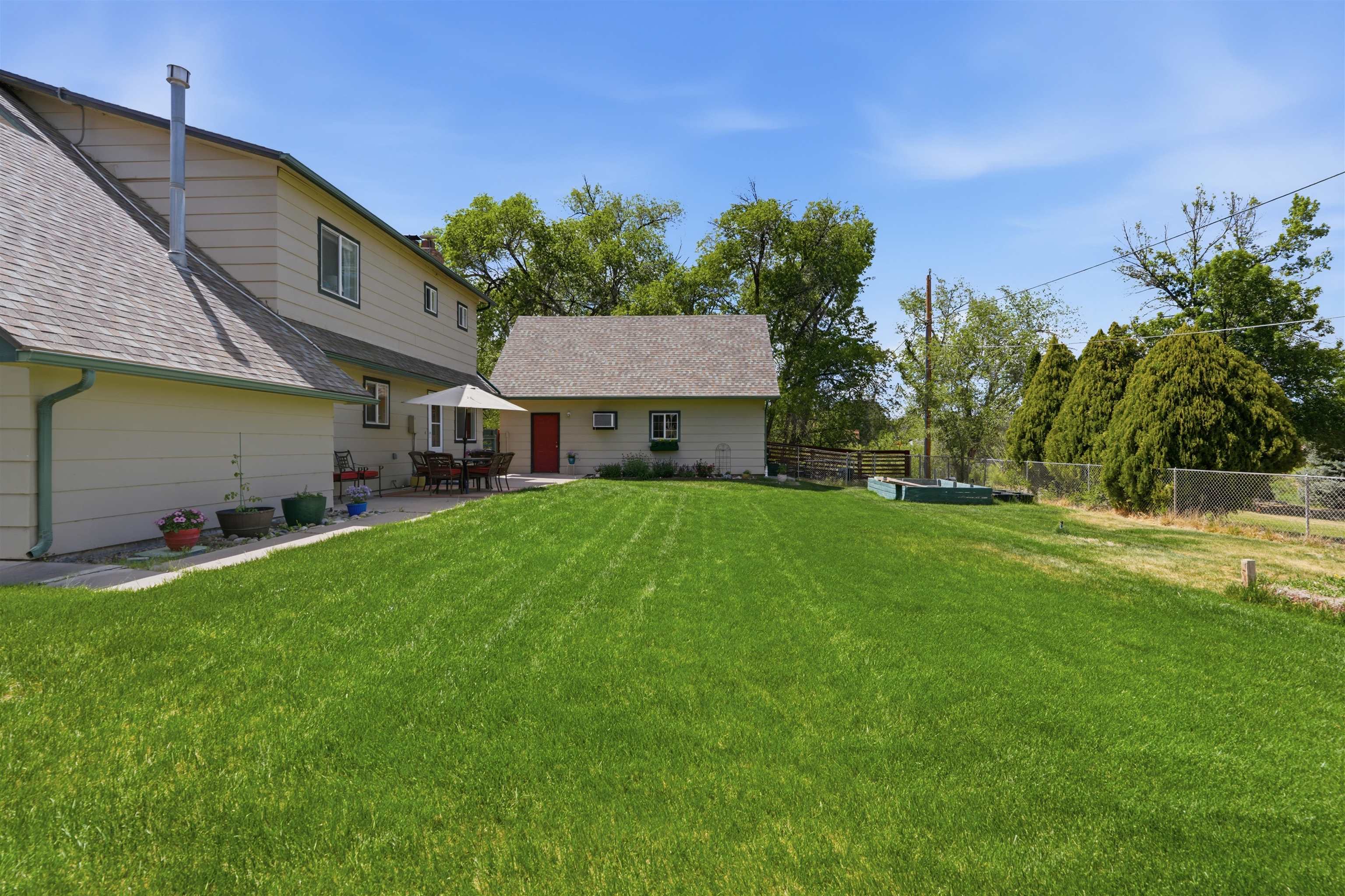 2350 E Road Grand Junction, CO 81507 - Photo 6 of 41 a front view of house with yard and green space