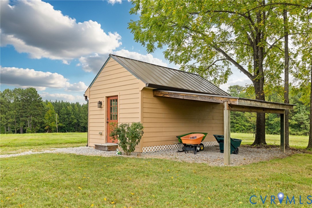 2284 Wallace's Bridge Road Lunenburg, VA 23952 - Photo 59 of 89 Detached structure featuring a metal roof, board-a