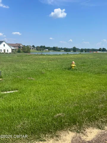 a view of a golf course with a lake