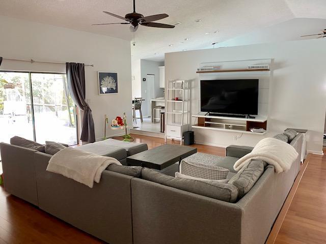 21077 Shady Vista Lane Boca Raton, FL 33428 - Photo 12 of 26 FAMILY/LIVING RM VIEW TO POOL & KITCHEN