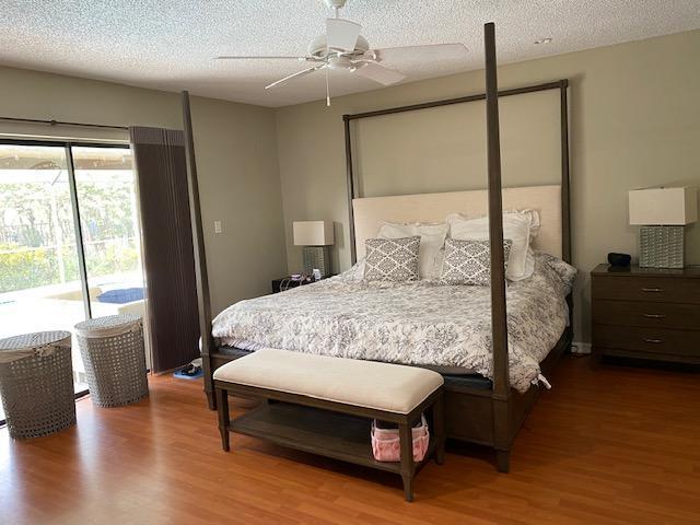 21077 Shady Vista Lane Boca Raton, FL 33428 - Photo 18 of 26 MASTER BEDROOM~VIEW TO POOL/PATIO