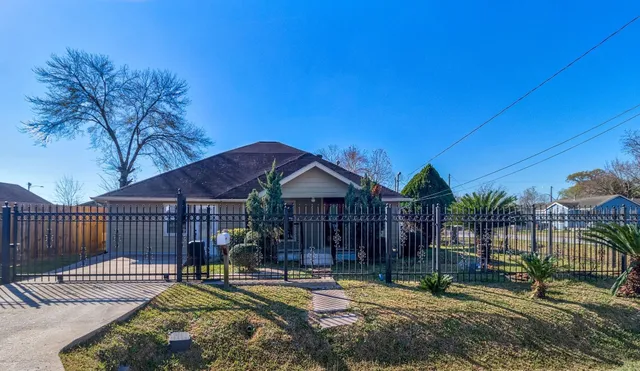 a view of a house with a yard balcony and furniture