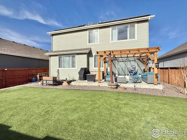 a view of a patio with table and chairs and potted plants