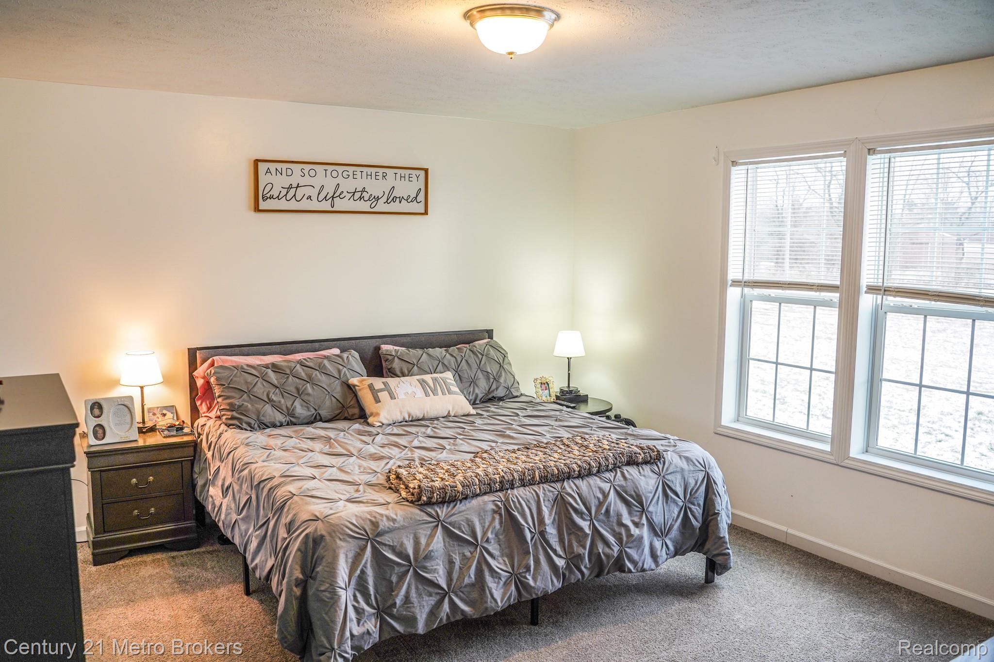 6449 Oliver Road Fostoria, MI 48435 - Photo 5 of 17 Carpeted bedroom with a textured ceiling