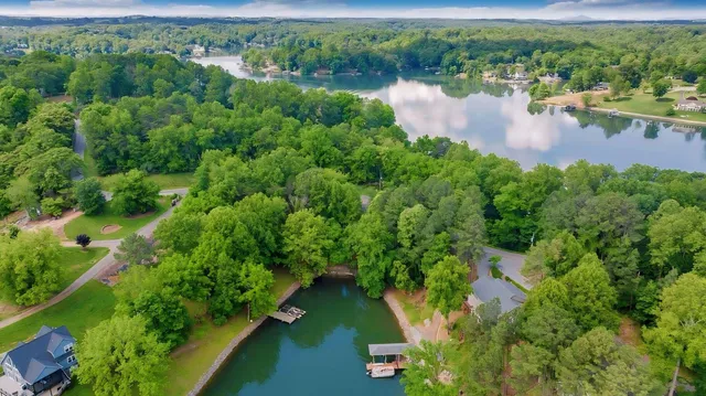 a view of a lake with green field