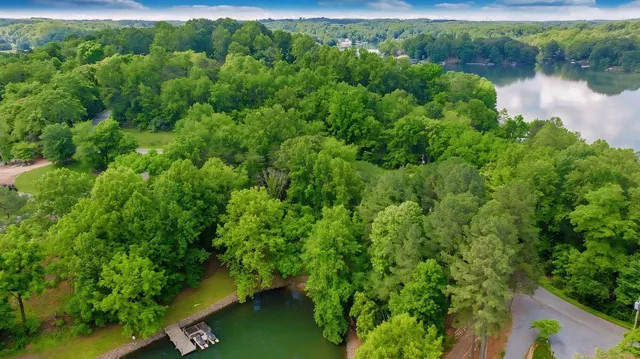 a view of a lake with houses in the back