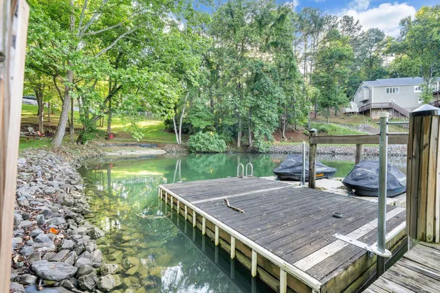 a view of a backyard with a deck and a garden