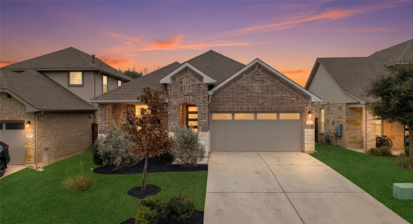 2416 Bear Cub Bend Leander, TX 78641 - Photo 1 of 24 a front view of a house with garden
