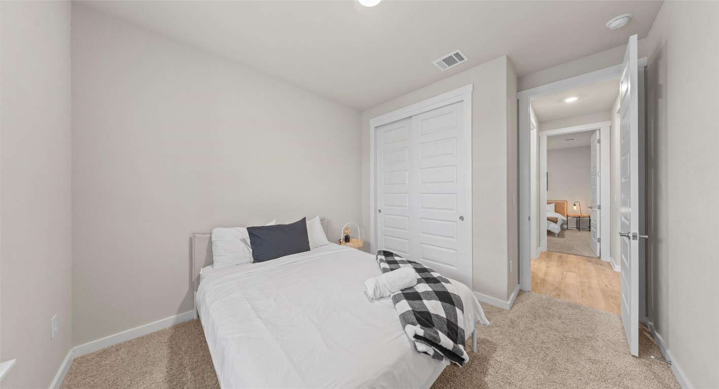 2416 Bear Cub Bend Leander, TX 78641 - Photo 13 of 24 a bedroom with a bed and a view of bathroom