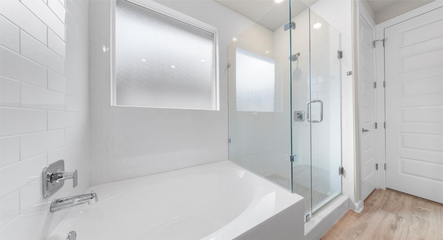 2416 Bear Cub Bend Leander, TX 78641 - Photo 17 of 24 a bathroom with a tub and shower