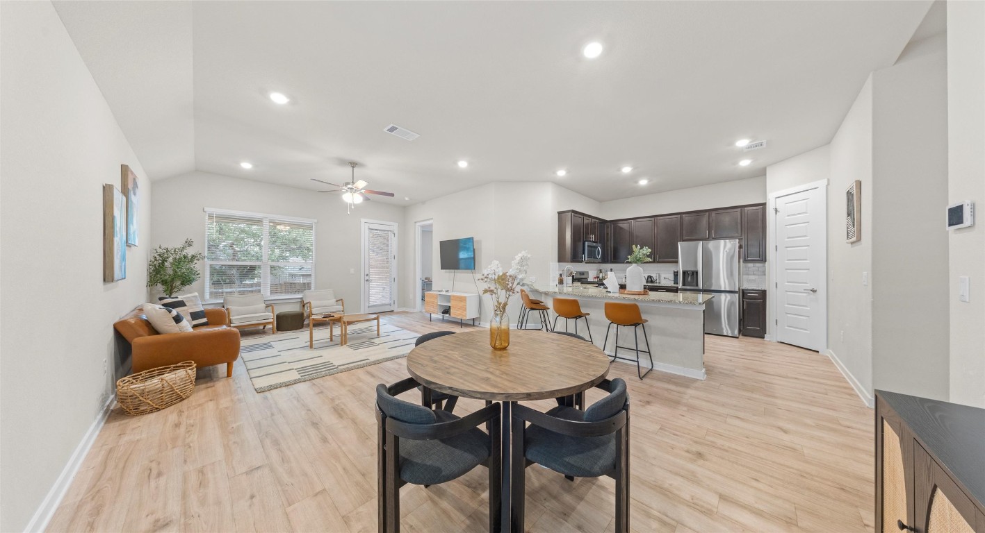 2416 Bear Cub Bend Leander, TX 78641 - Photo 3 of 24 a large kitchen with a table and chairs