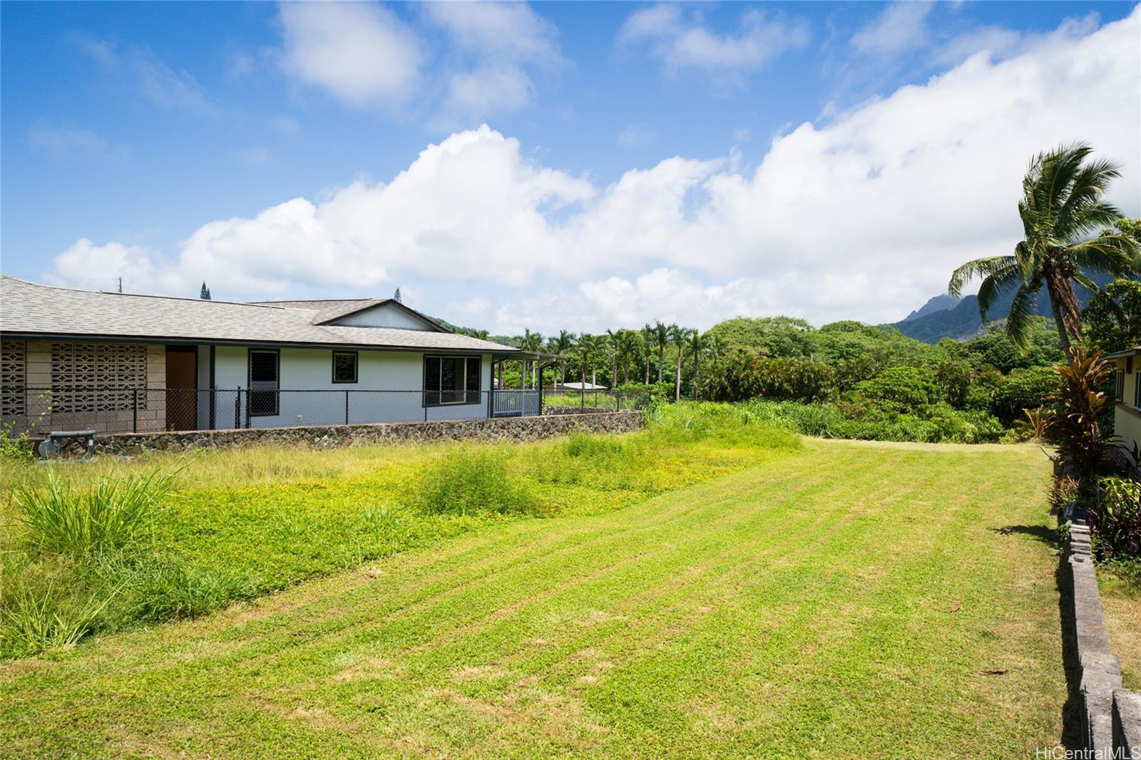 47-318 Waihee Road Kaneohe, HI 96744 - Photo 11 of 15 a front view of house with yard and swimming pool