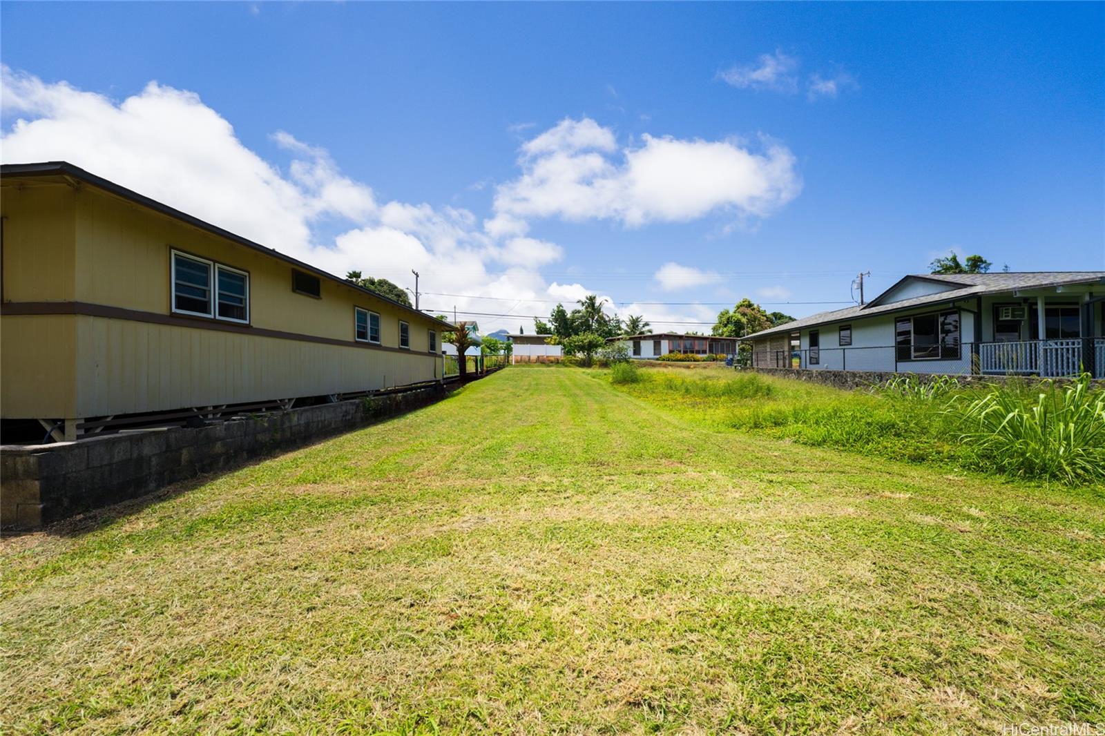 47-318 Waihee Road Kaneohe, HI 96744 - Photo 13 of 15 a view of a swimming pool with an outdoor space and seating area