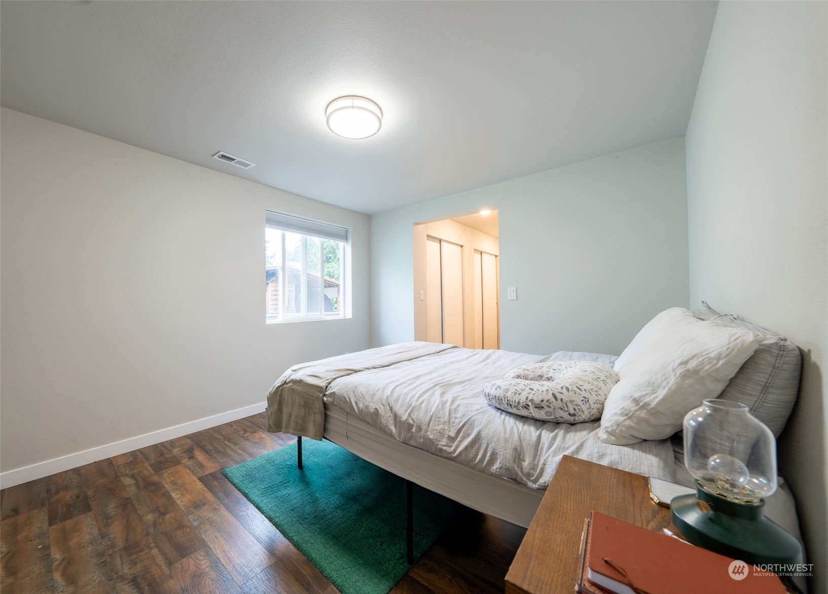 5515 South Bangor Street Seattle, WA 98178 - Photo 11 of 33 a bedroom with a bed and a window