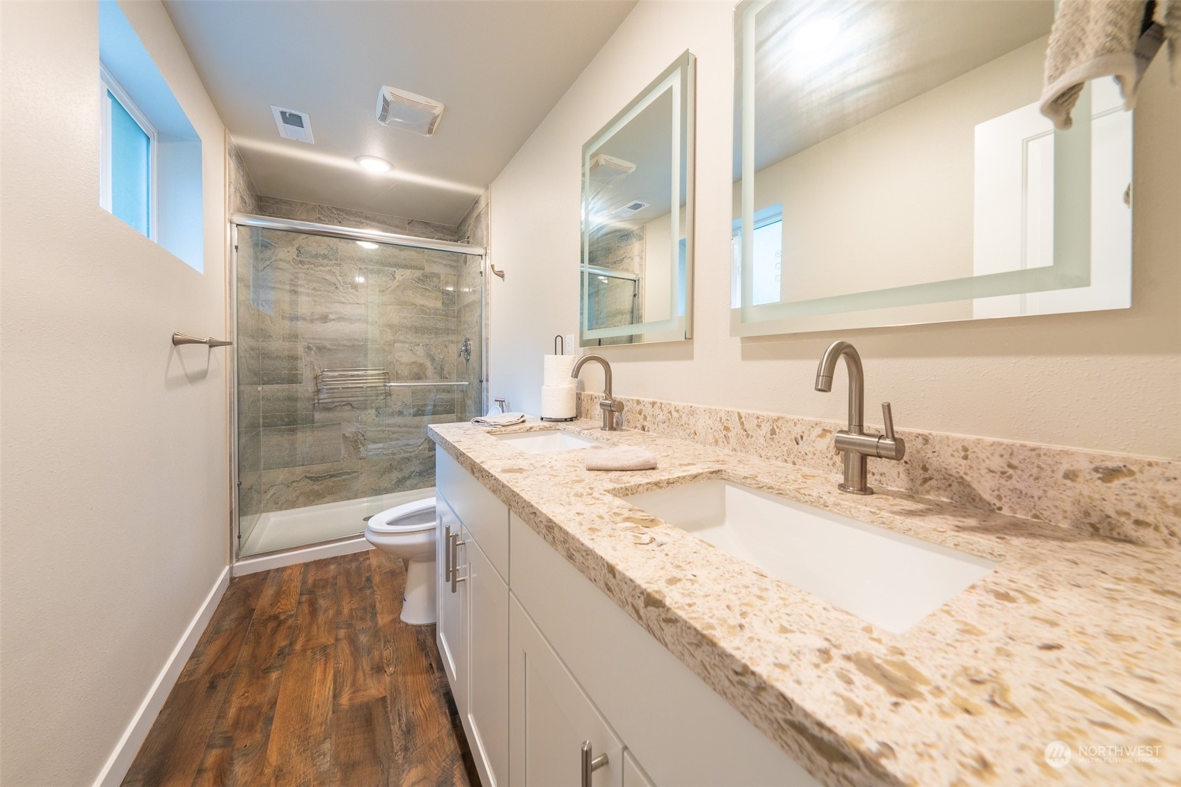 5515 South Bangor Street Seattle, WA 98178 - Photo 14 of 33 a bathroom with a granite countertop sink a mirror and shower