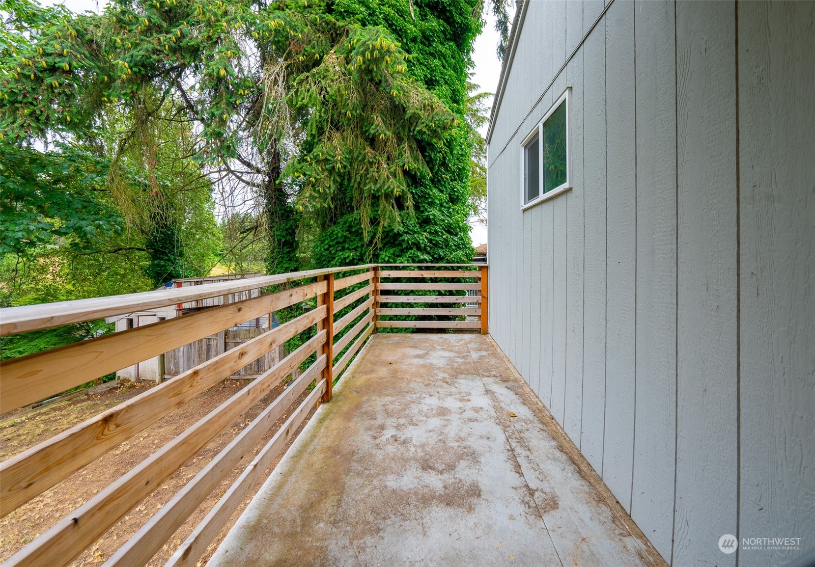 5515 South Bangor Street Seattle, WA 98178 - Photo 15 of 33 a view of a balcony with wooden floor and fence