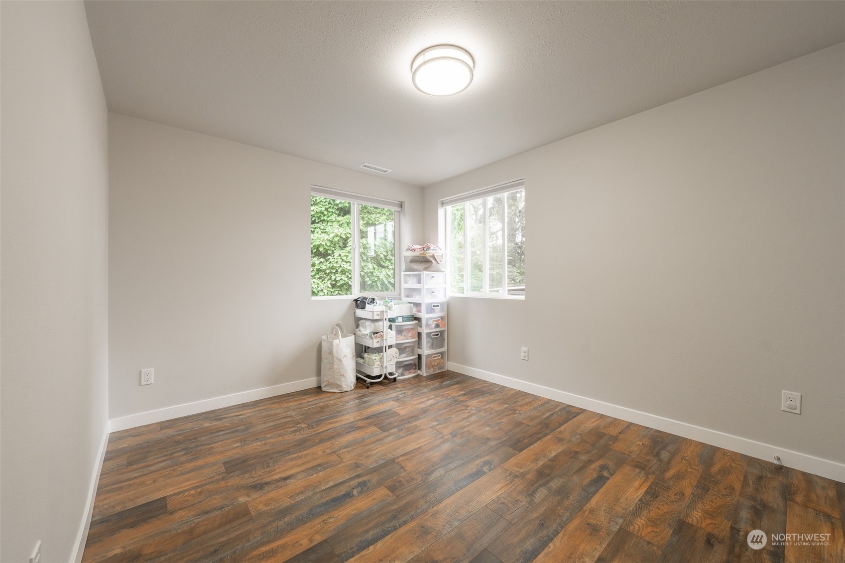 5515 South Bangor Street Seattle, WA 98178 - Photo 16 of 33 an empty room with wooden floor and a window