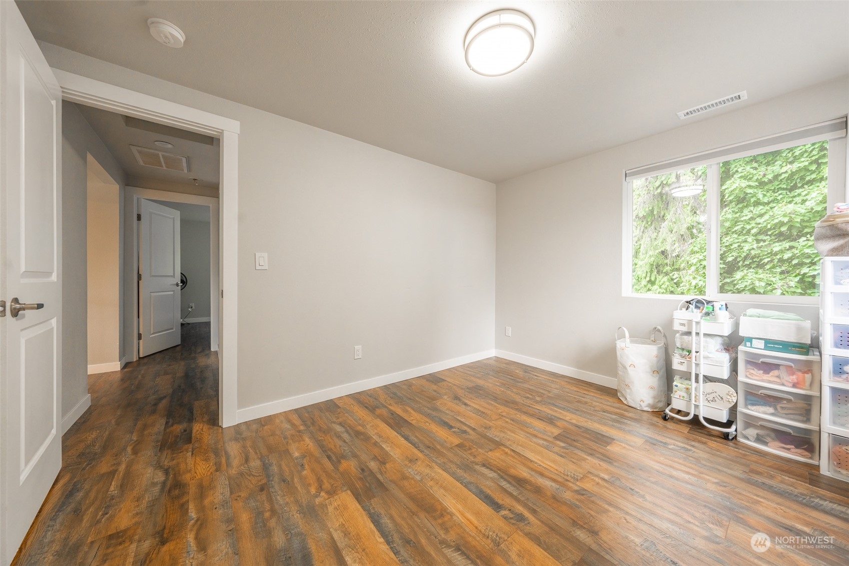 5515 South Bangor Street Seattle, WA 98178 - Photo 17 of 33 a view of empty room with wooden floor and fan