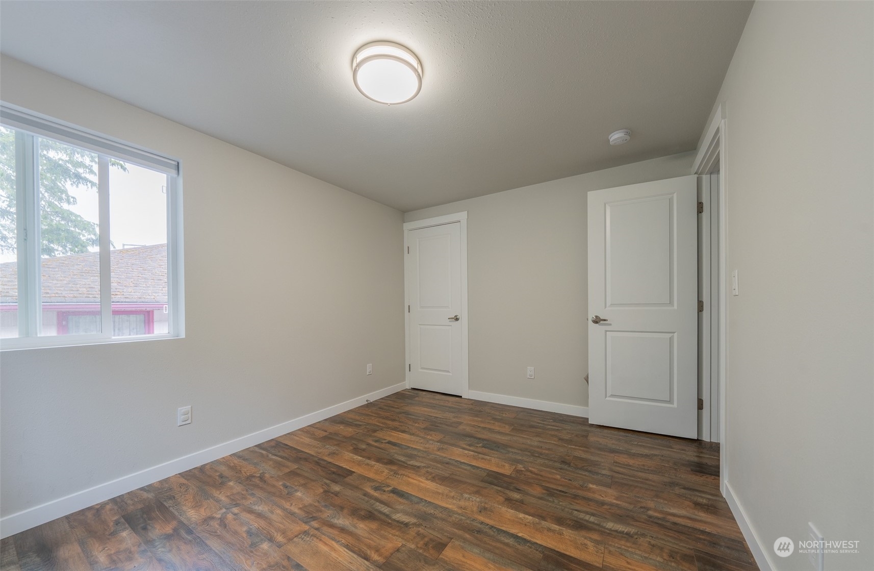 5515 South Bangor Street Seattle, WA 98178 - Photo 18 of 33 wooden floor in an empty room with a window