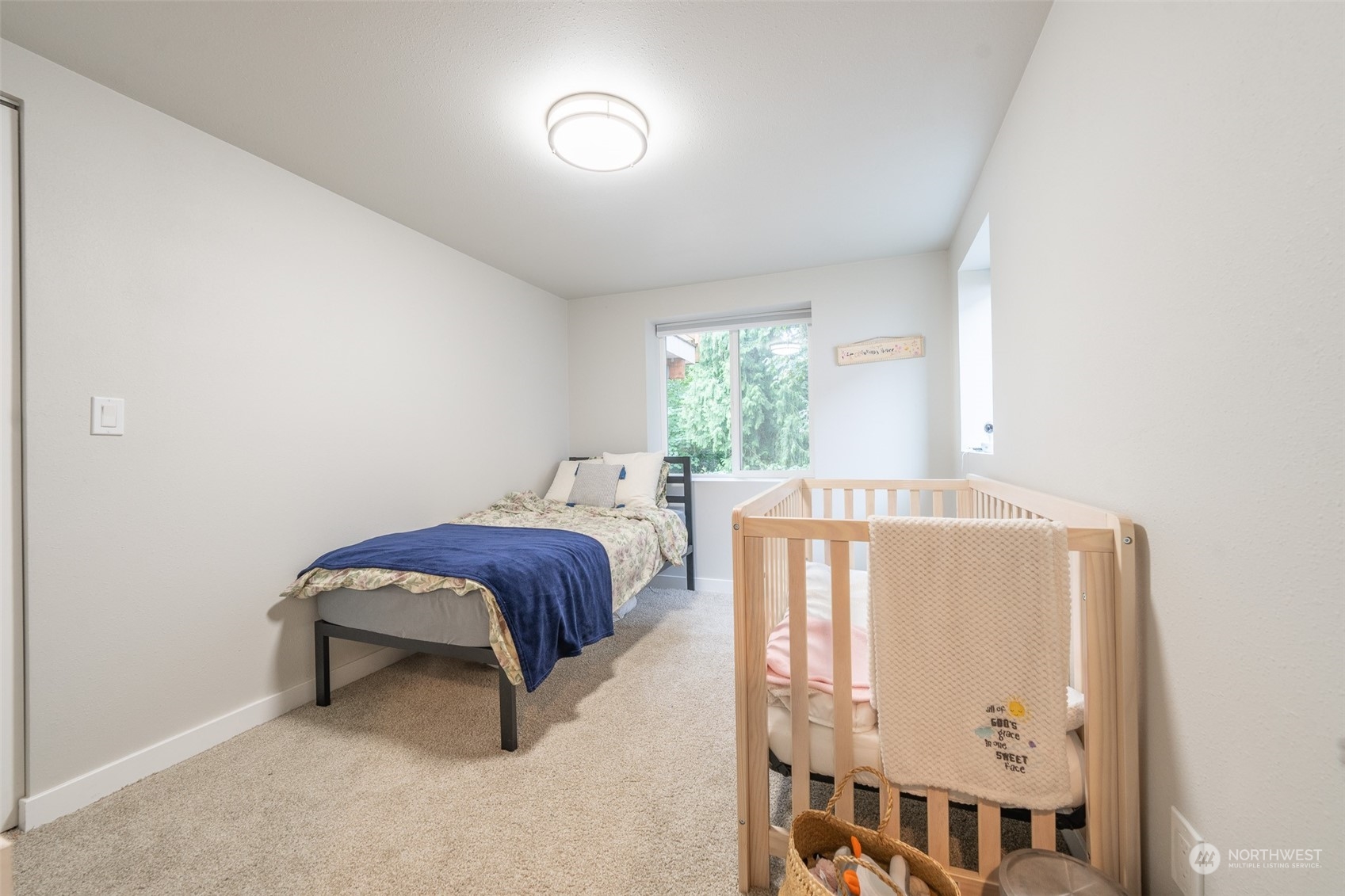 5515 South Bangor Street Seattle, WA 98178 - Photo 25 of 33 a bedroom with a bed and window