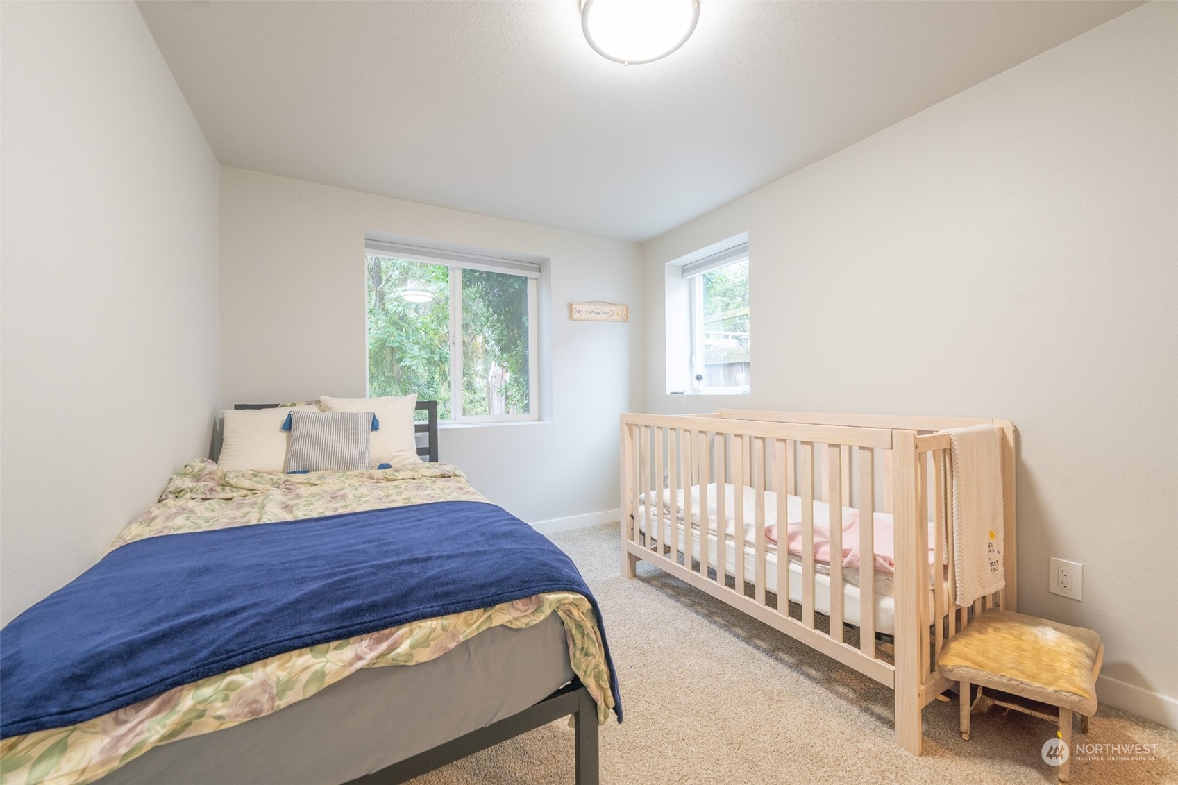5515 South Bangor Street Seattle, WA 98178 - Photo 26 of 33 a bedroom with a bed and window