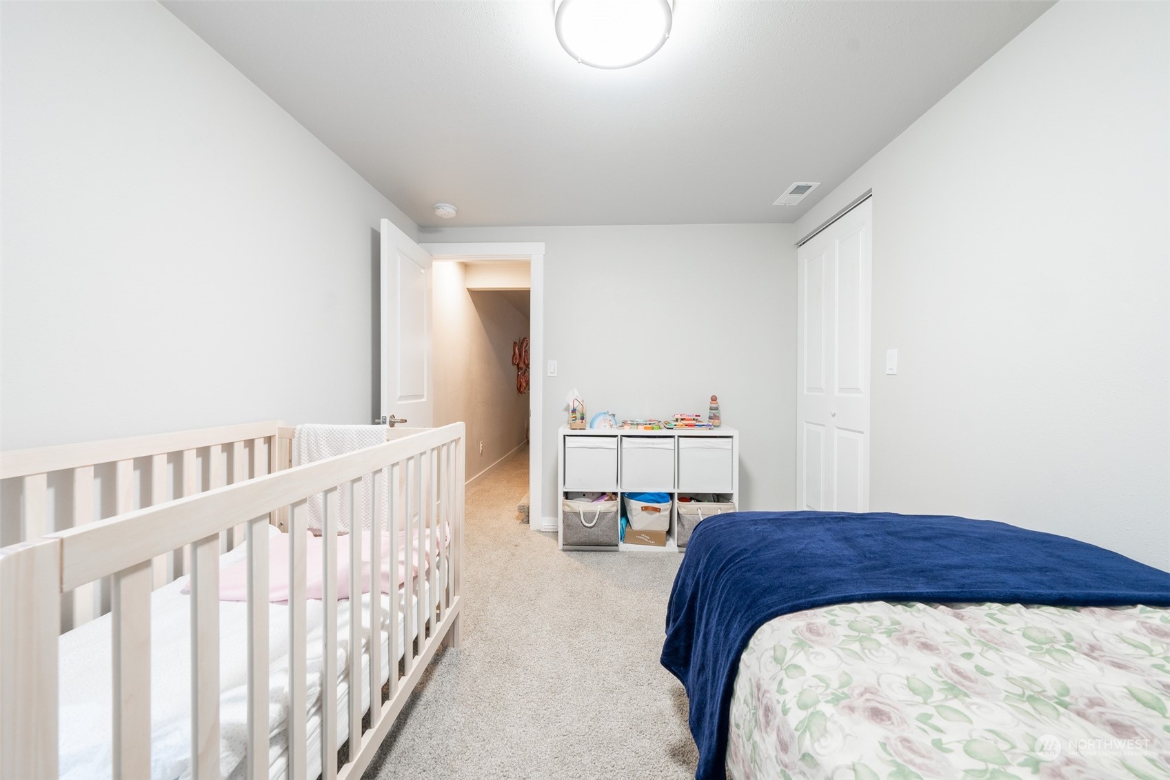 5515 South Bangor Street Seattle, WA 98178 - Photo 27 of 33 a bedroom with a bed a table and chair