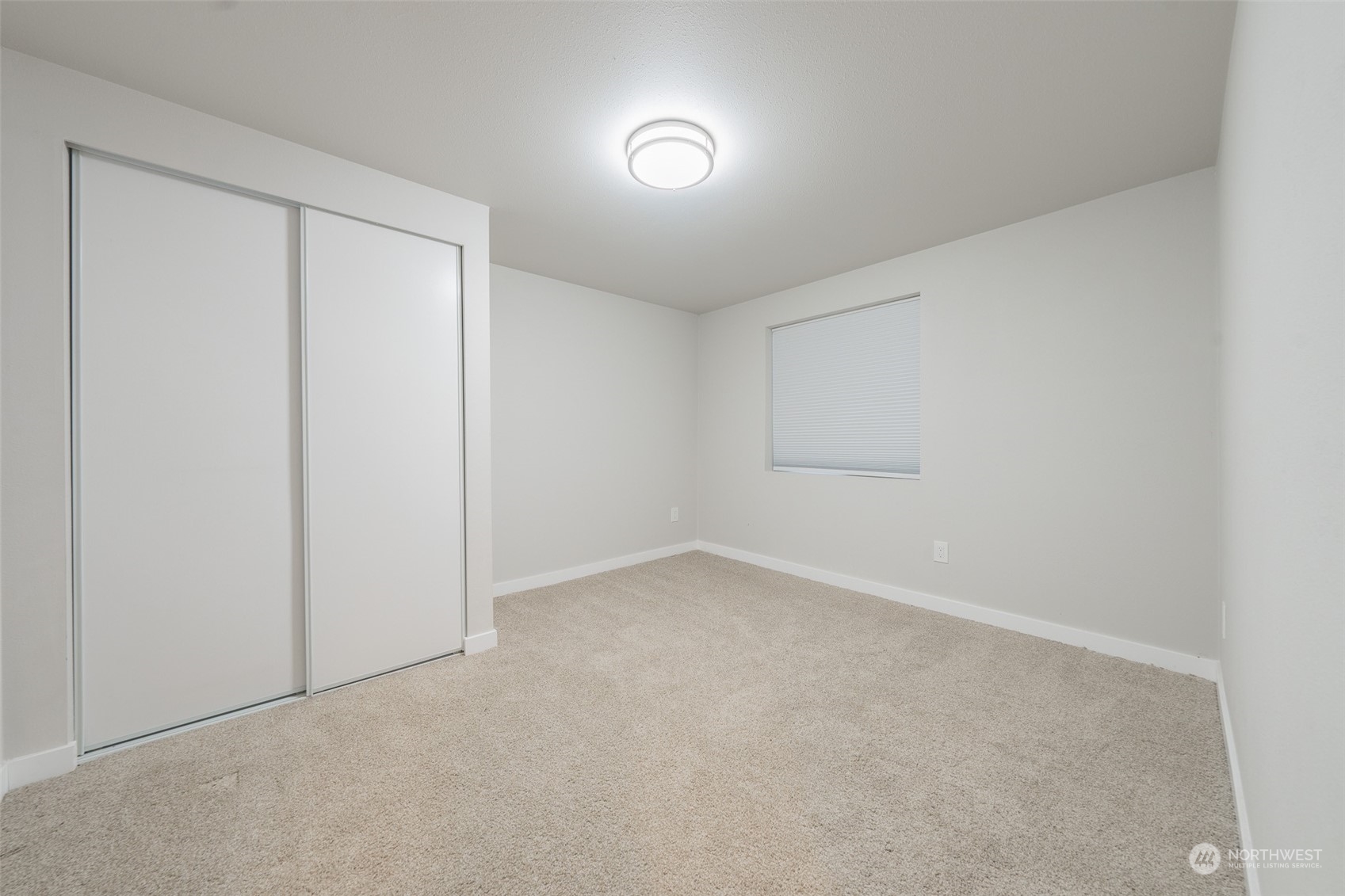 5515 South Bangor Street Seattle, WA 98178 - Photo 30 of 33 an empty room with a empty space and windows