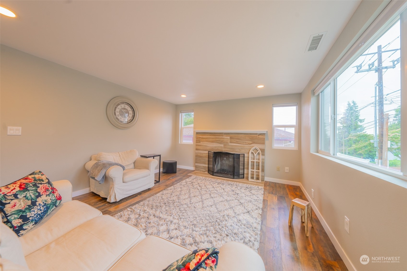 5515 South Bangor Street Seattle, WA 98178 - Photo 3 of 33 a living room with furniture and a fireplace