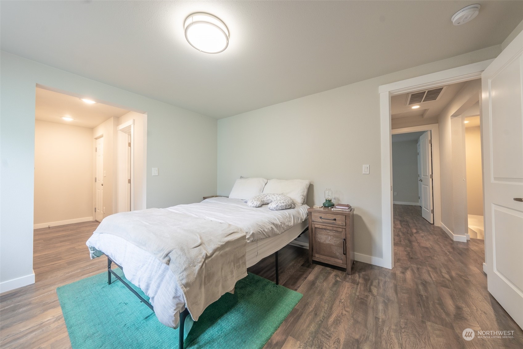 5515 South Bangor Street Seattle, WA 98178 - Photo 4 of 33 a bedroom with a bed and a mirror