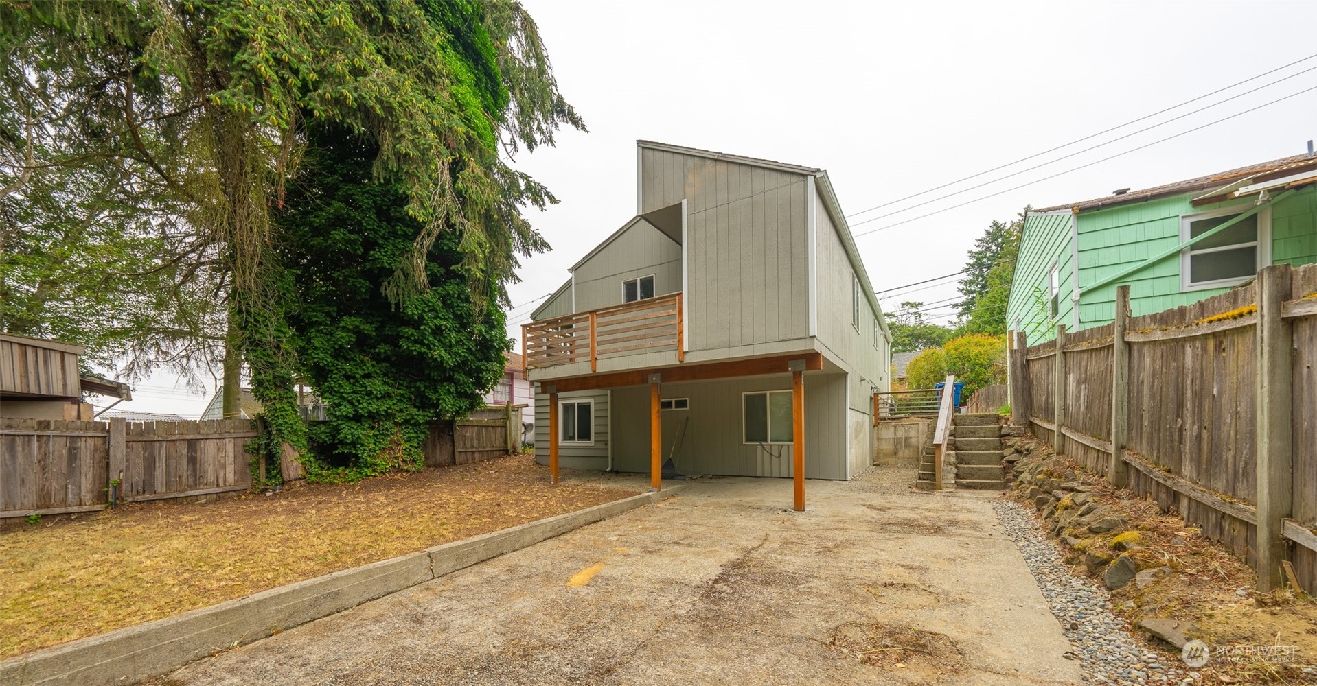 5515 South Bangor Street Seattle, WA 98178 - Photo 6 of 33 a front view of a house with a yard