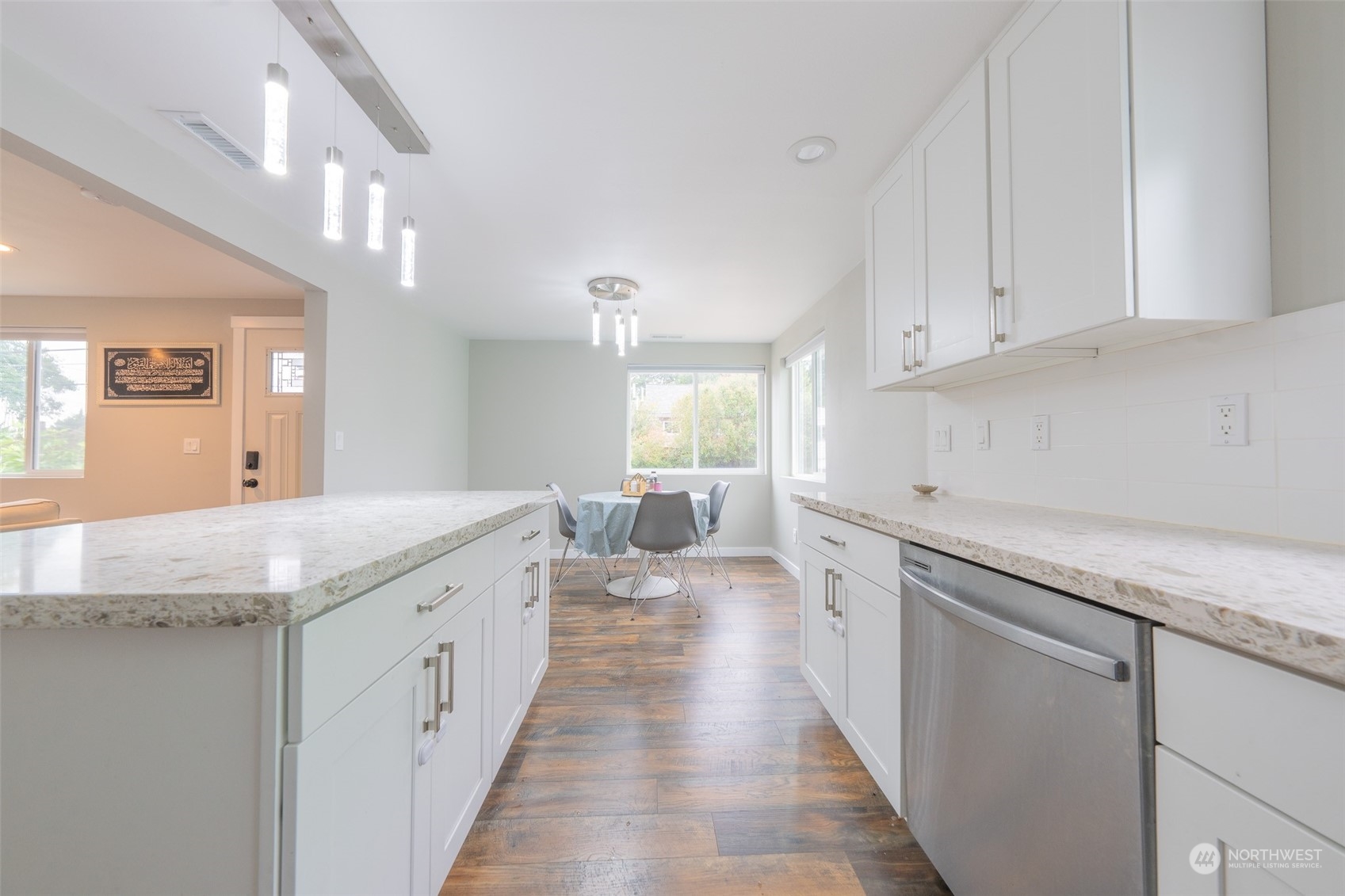 5515 South Bangor Street Seattle, WA 98178 - Photo 10 of 33 a kitchen with granite countertop a sink and cabinets
