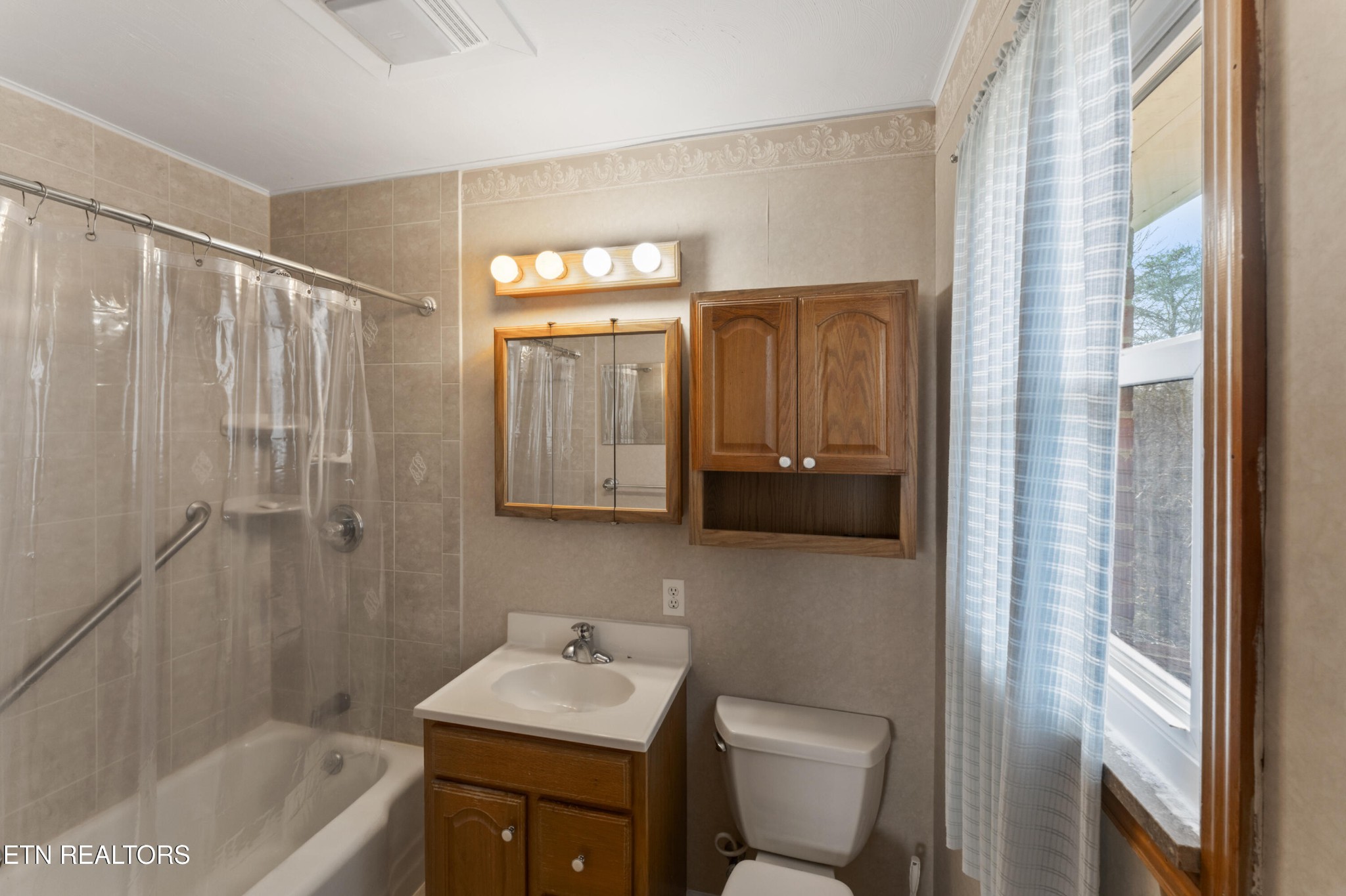 145 Short Street Kingston, TN 37763 - Photo 12 of 29 a bathroom with a sink a toilet and shower