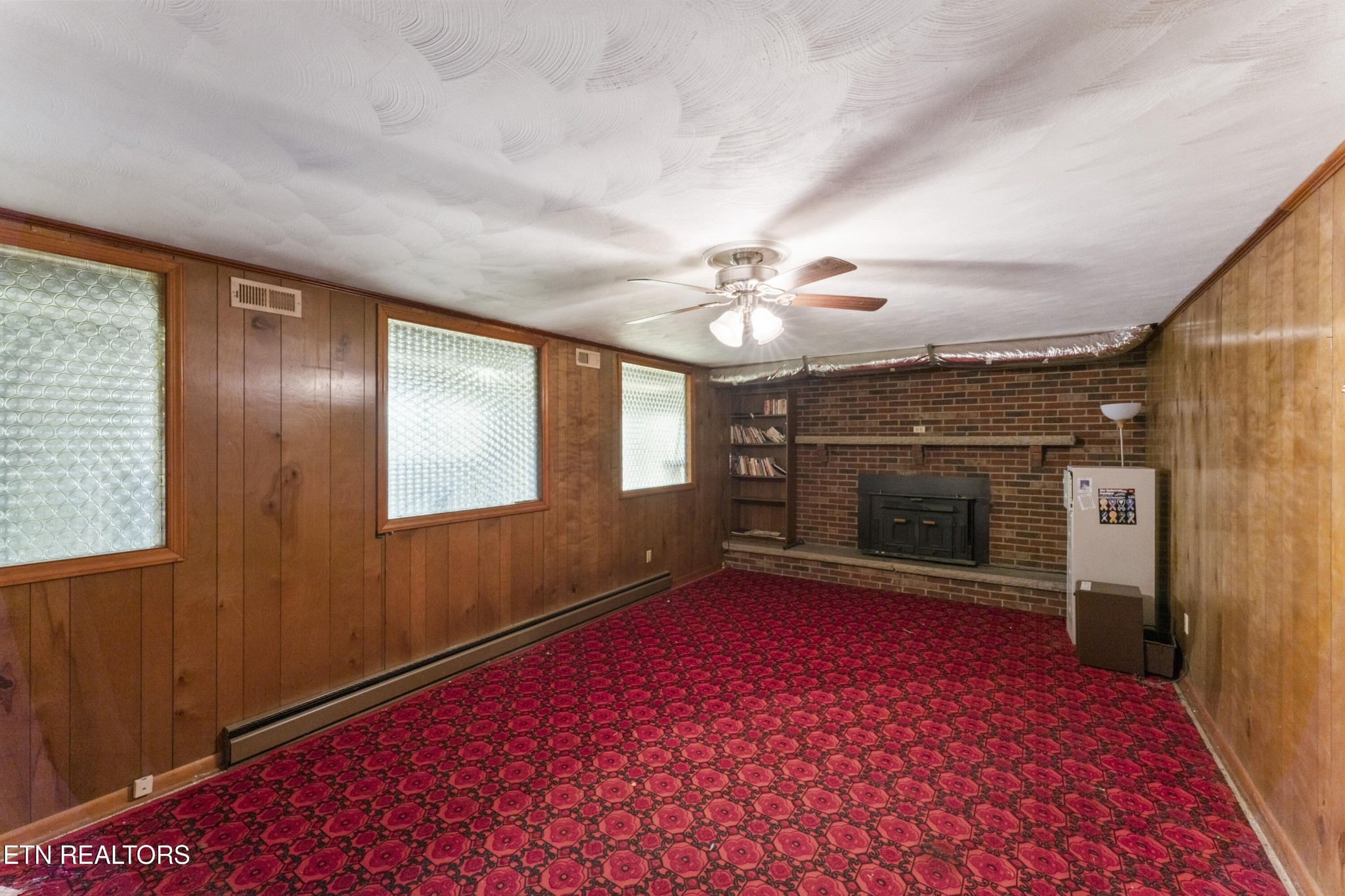 145 Short Street Kingston, TN 37763 - Photo 16 of 29 wooden floor in an empty room with a fireplace