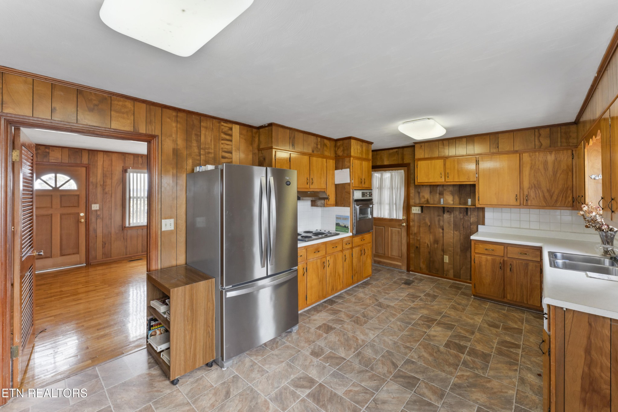 145 Short Street Kingston, TN 37763 - Photo 5 of 29 a kitchen with granite countertop a refrigerator and a sink