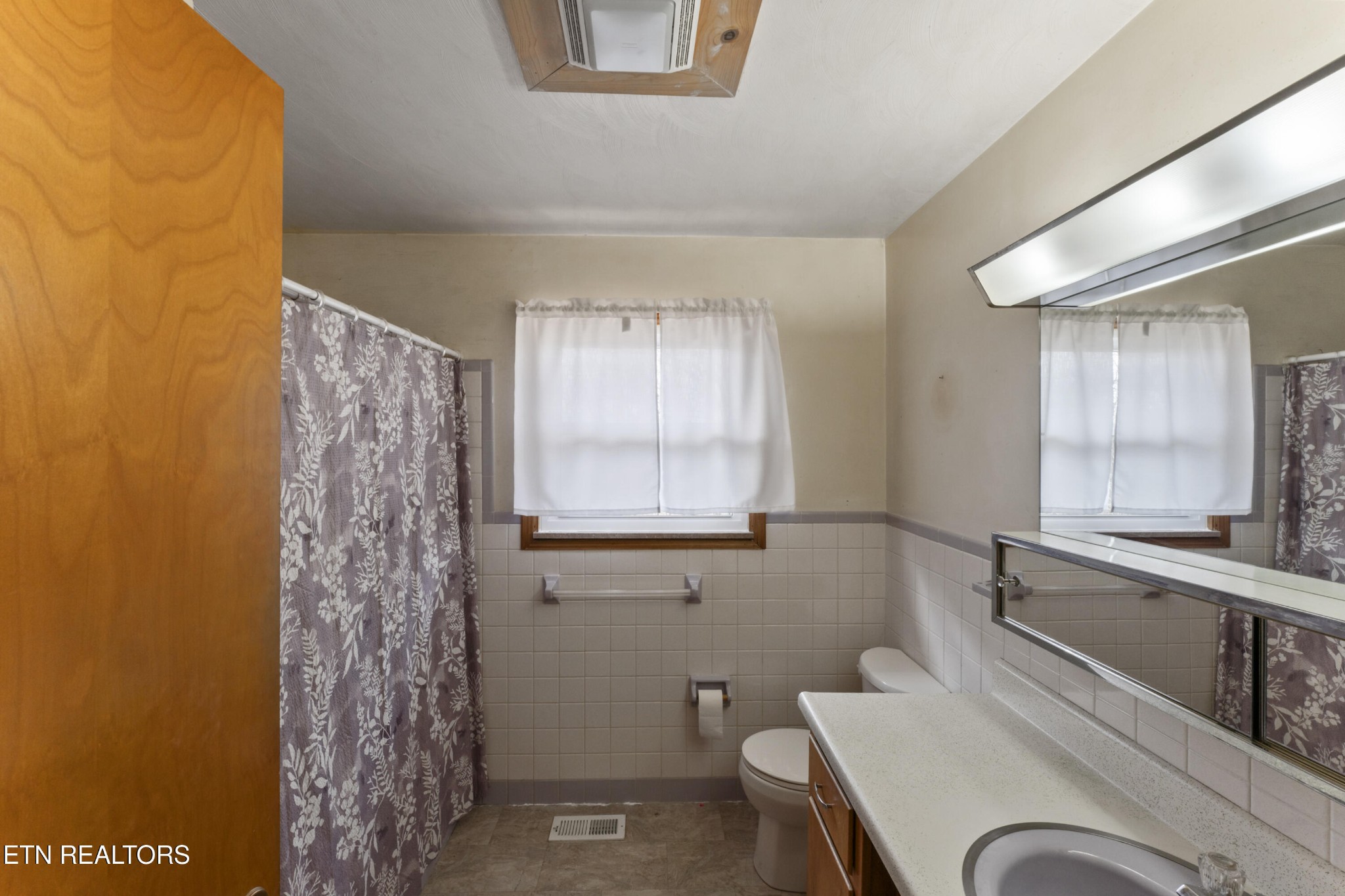 145 Short Street Kingston, TN 37763 - Photo 9 of 29 a bathroom with a granite countertop sink toilet a mirror and shower