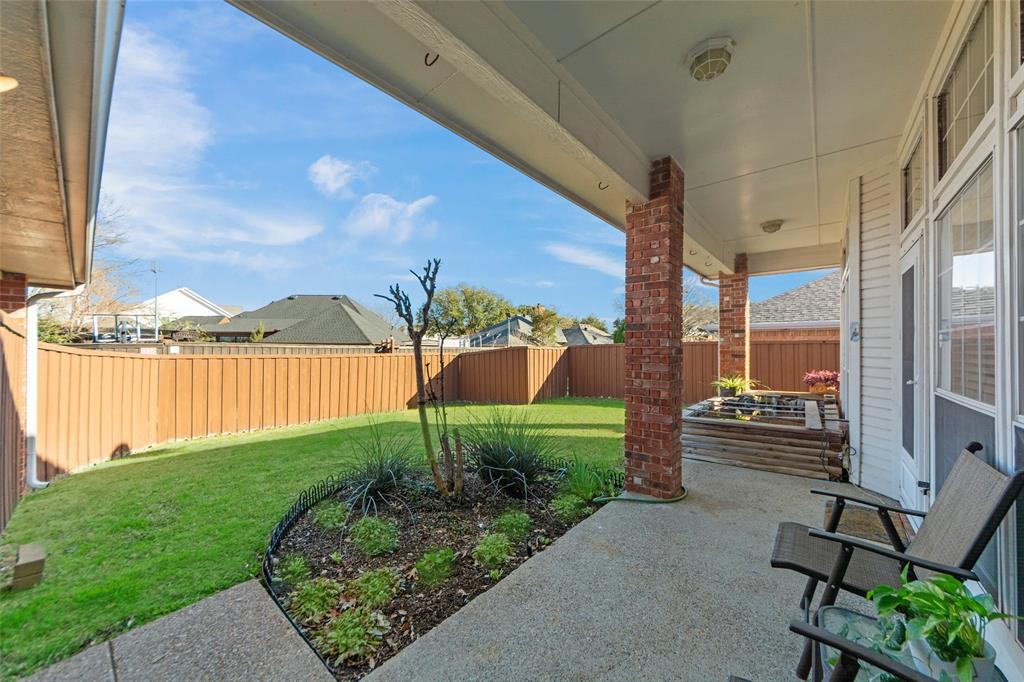 3308 North Spring Drive Richardson, TX 75082 - Photo 28 of 38 The private backyard offers a perfect blend of relaxation and entertainment. A spacious covered patio provides shade and comfort for outdoor dining or quiet mornings with coffee. Beautifully maintained flower beds add color and charm, while the raised koi ponds create a tranquil focal point and unique conversation piece. With plenty of grassy space for play or pets, this backyard is designed for both peaceful enjoyment and memorable gatherings.