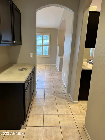 a hallway with a black white checkered floor