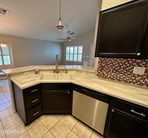 a kitchen with a sink and a microwave