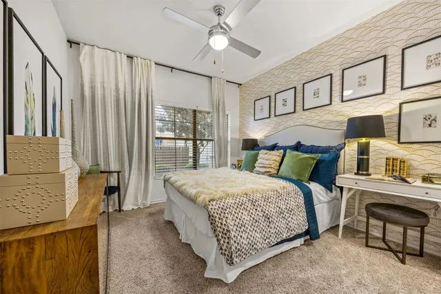 a bed room with a bed and a chandelier