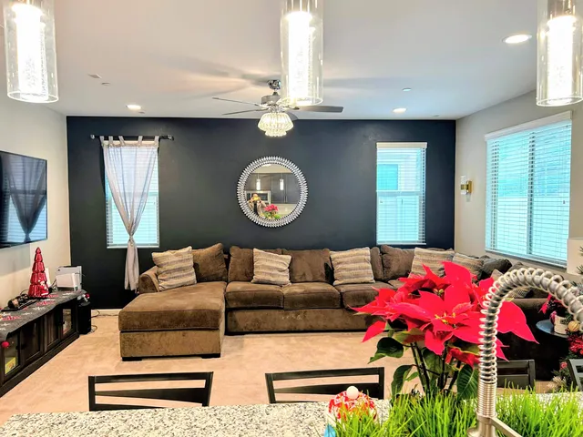 a living room with furniture and a large window