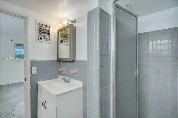 a view of a livingroom with a chandelier fan
