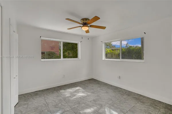 a view of an empty room with a window