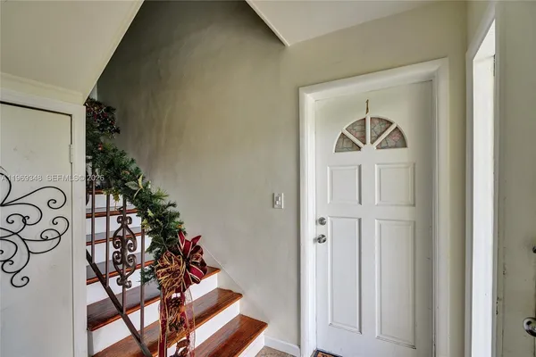 a view of entryway with wooden floor